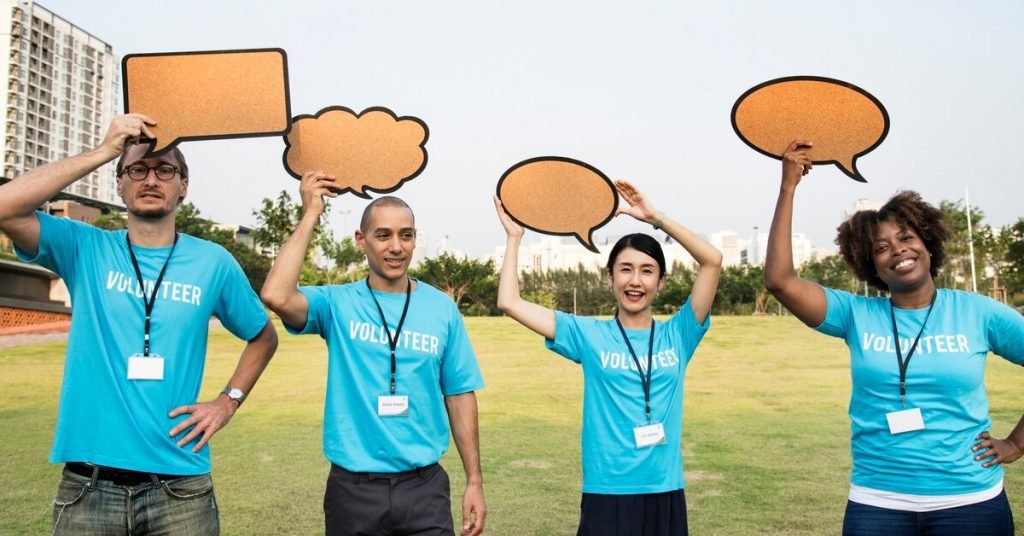 a group of people holding up speech bubbles