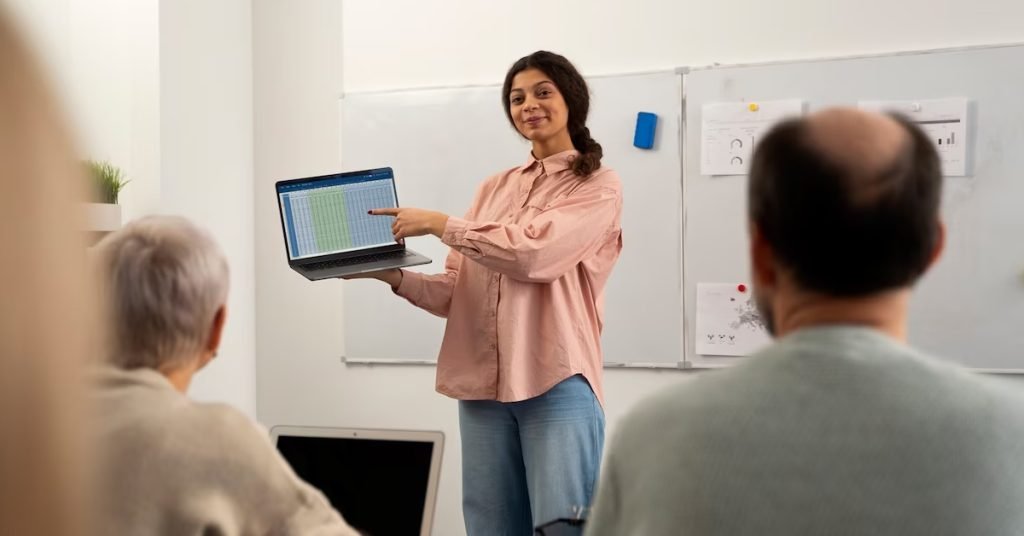 a girl pointing at the laptop