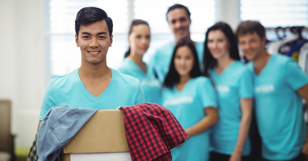 a group of people wearing blue shirts written volunteer on it