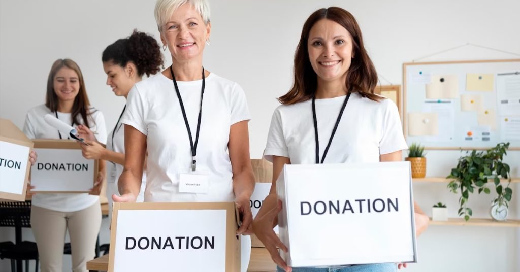 a group of women holding donation boxes