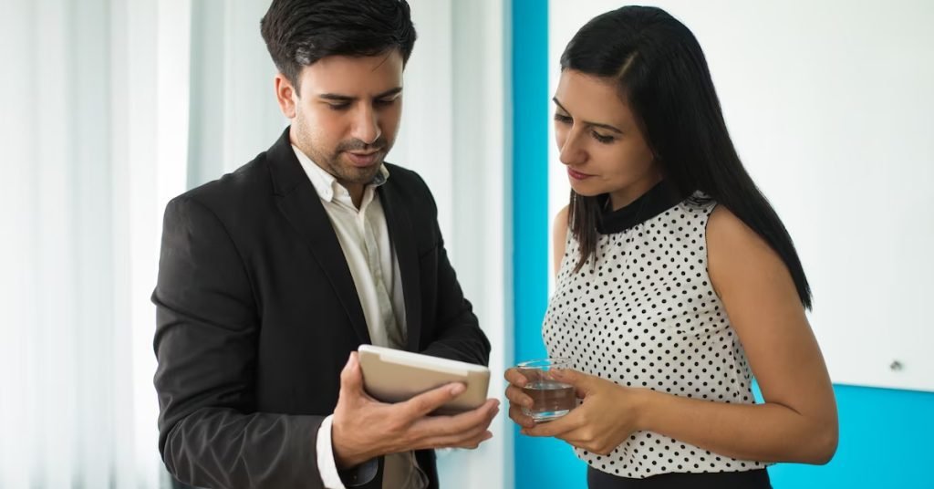 a men and a women looking at the tablet