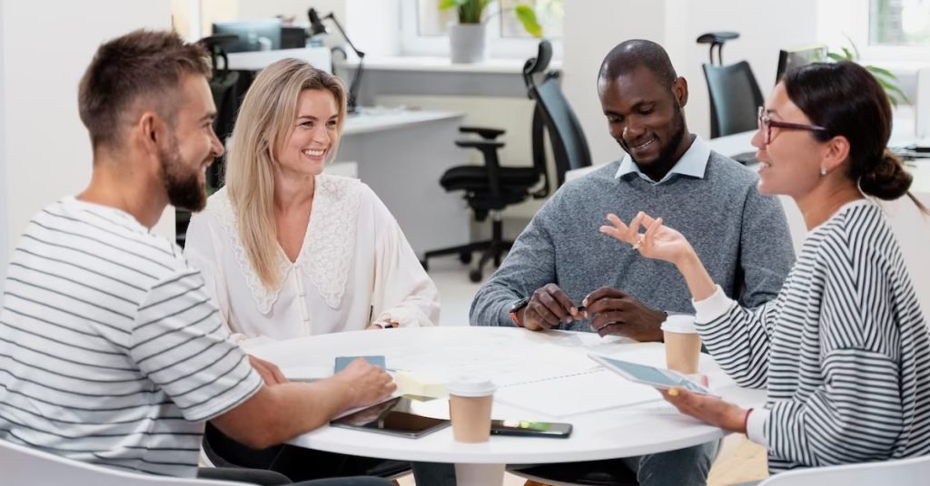 a group of people sitting around a round table