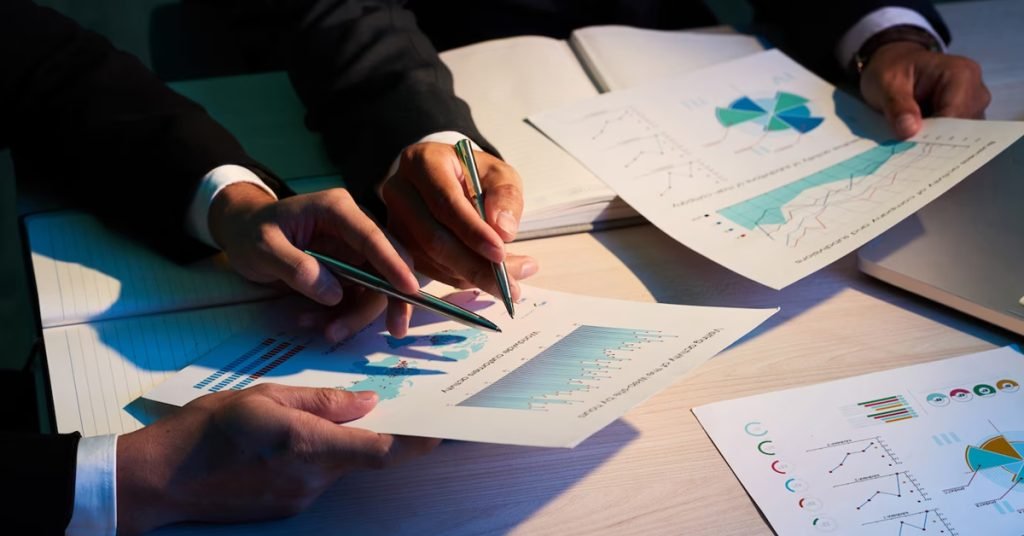 a pair of hands holding pen and paper