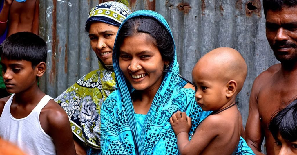 a group of women and a one holding the baby