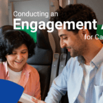 a men showing a book to a women signifying the topic for Engagement Audit